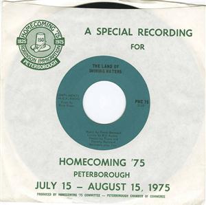 A paper cover containing a black 45 record with green centre label. The information reads, "A special recording for Homecoming '75" with further dates and details.