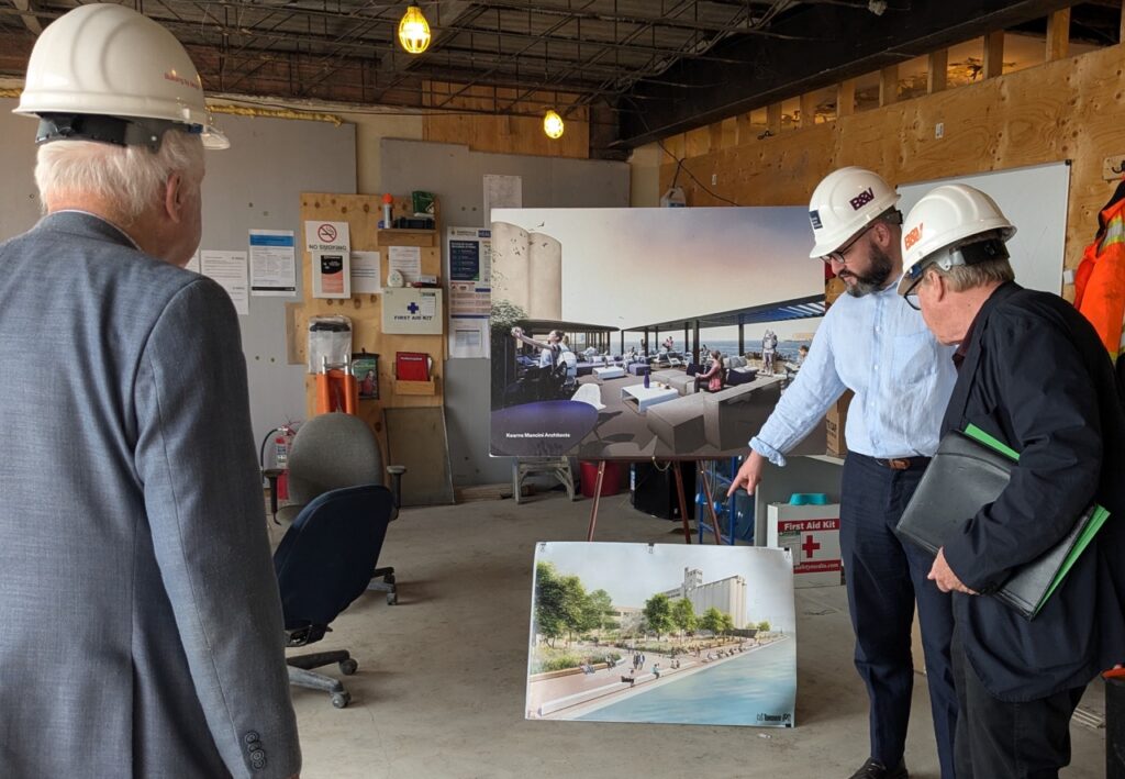 Nine Ships 1825 Board Member Elwood Jones and Chair Brendan Moher learn about plans for Canada Ireland Foundation Corleck Building from Executive Director William Peat.