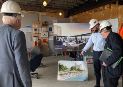 Nine Ships 1825 Board Member Elwood Jones and Chair Brendan Moher learn about plans for Canada Ireland Foundation Corleck Building from Executive Director William Peat.